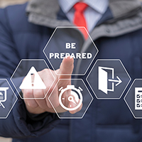 Decorative image of a person pointing to a digital image that says Be Prepared.